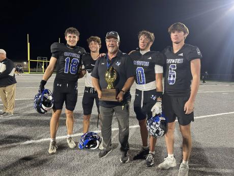Head coach Harley Ethridge celebrates with Richland Springs after a playoff win during the 2025 football season.