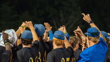The Angelo State baseball team huddles during the 2026 season.