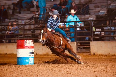 A barrel racer competes in the Texas High School Rodeo Association State Finals in 2025.