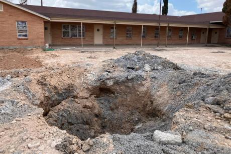 A pit in the parking lot of the First Baptist Church in Grandfalls, where the Railroad Commission plugged a wellbore that had gushed thousands of gallons of wastewater. Grandfalls is southwest of Odessa, between Monahans and Fort Stockton.
