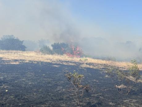 A wildfire south of Sonora has already burned approximately 1,200 acres and only remains about 25% contained, according to Sutton County Emergency Management.