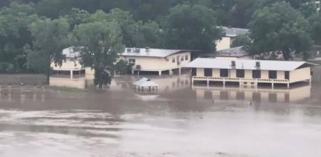 The Guadalupe River in Kerr County surged over its banks Thursday, July 16, 2026.