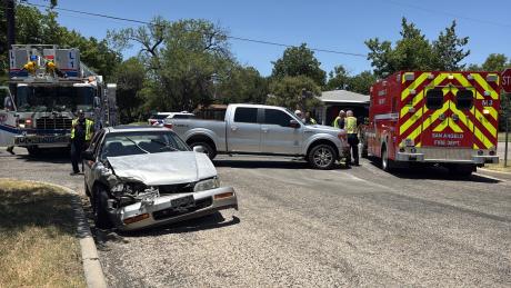 A woman was taken to the hospital Friday afternoon after a two-vehicle collision in a residential area.