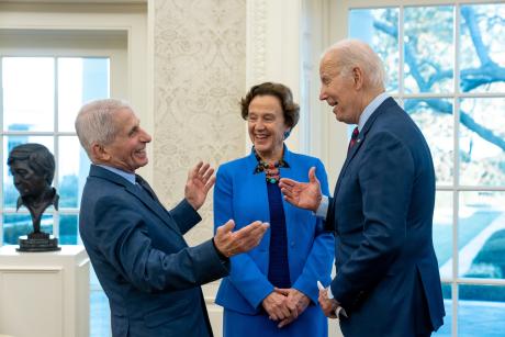 Dr. Anthony Fauci shares a laugh with President Joe Biden.