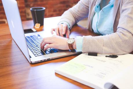 A woman working on her laptop computer.