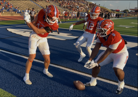 Central's Tucker Beaty does a golf celebration after scoring a touchdown against Abilene High on Friday, Aug. 28, 2026, at San Angelo Stadium.