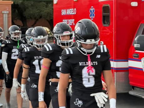 Water Valley football players, led by Branson Lacy (6) walk onto the field before their game against Rankin on Friday, Sept. 4, 2026.