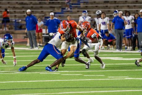 San Angelo Central's Gavin Johnson makes a catch in traffic against Abilene Cooper on Friday, Sept. 11, 2026.