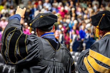 ASU’s first Psy.D. graduates, Drs. Lee Floyd and Kate Vick, acknowledge the audience at spring 2026 commencement.