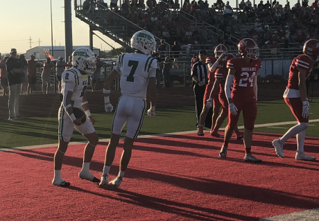 Wall's Gunner Garza (2) celebrates with Braylon Nelson (7) after Garza's touchdown run against Jim Ned on Friday, Sept. 11, 2026.