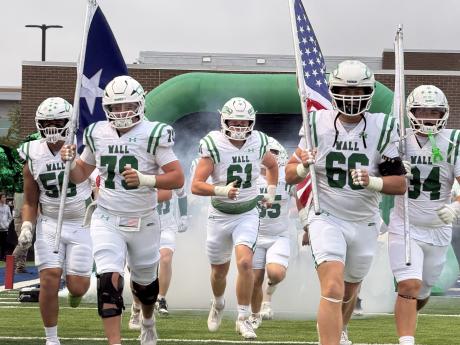 The Wall Hawks run out onto the field on Oct. 2, 2026.