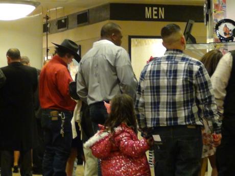 A dad and daughter walk arm in arm (LIVE! photo by Cheyenne Benson)