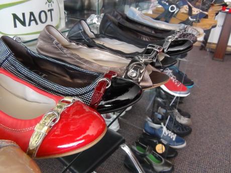 Orthopedic shoes line the shelves (LIVE! photo by Cheyenne Benson)