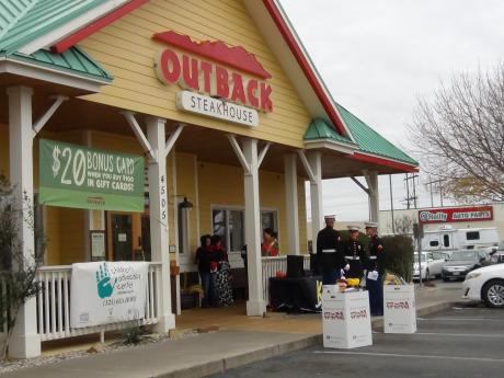 Marines await toy donations, braving the cold weather, in front of Outback Steakhouse (LIVE! photo by Cheyenne Benson)