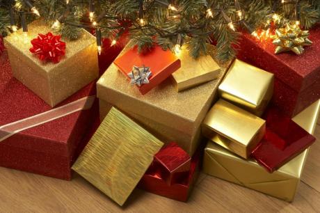 Gifts lay wrapped under a tree (photo couresty of janetprezekckles.com)