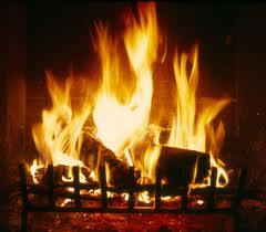 A log burns in the fireplace (photo from blogs.timeunion.com)