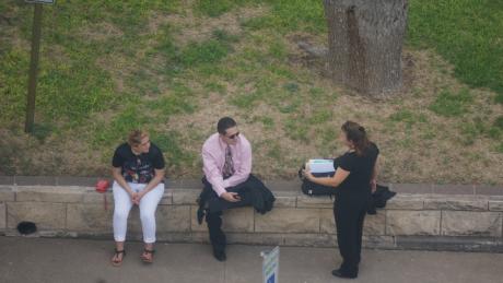 Serrano (center) and his attorney (right) converse outside the courthouse after trial is recessed Tuesday. (LIVE! Photo/Chelsea Schmid)