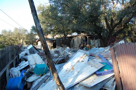 Only up close can you see the house hiding behind piles of junk and scrap in Christoval. (LIVE! Photo by Chelsea Schmid)