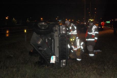 Champagne colored Jeep rolls after losing control on a patch of ice. (LIVE!! Photo by John Basquez)