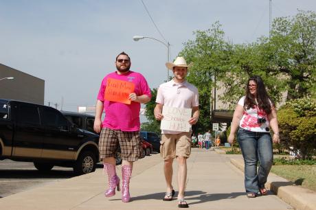 Men paraded around the courthouse Saturday in sparkly boots, pumps and flats to raise awareness for rape and sexual assault. (LIVE! Photo/Chelsea Schmid)