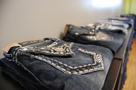 Jeans with plenty of bling on display at So Unique Boutique. (LIVE! Photo by Chelsea Schmid)