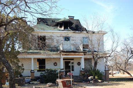 The shell of the Drake family home remains after a severe fire devastated the inside on Wednesday. (LIVE! Photo by John Basquez)