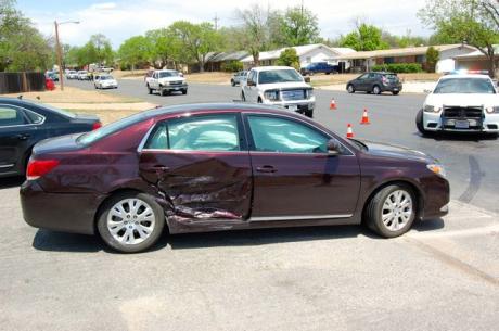 A Toyota Avalon was struck by a Chevy Impala when attempting to turn left from College Hills Dr. Apr. 23, 2014. (LIVE! Photo/Joe Hyde)