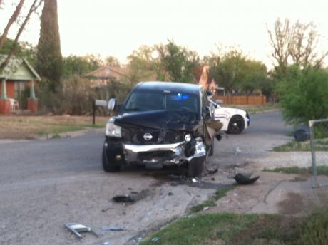 The black Nissan pickup that was hit multiple times by the same car in a hit and run Monday evening. (LIVE! Photo/John Basquez)