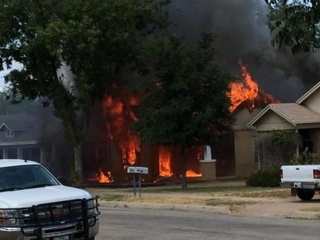 The fire fully engulfed a duplex residential building. (LIVE! Photo/John Basquez)