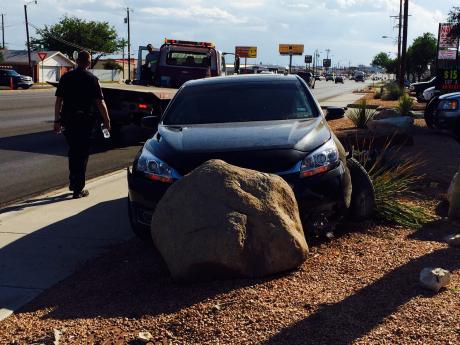 Police said the driver was drunk when he rearranged Fashion Cleaners' Xeriscaped lawn. (LIVE! Photo/John Basquez)