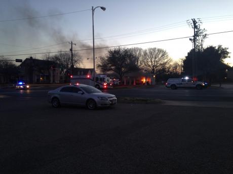 A fire burns near the YMCA building downtown. (LIVE! Photo by Hayden Hyde)