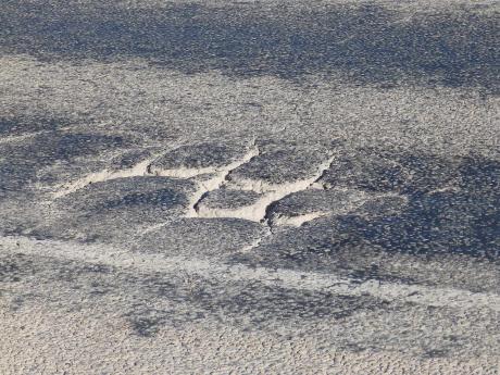 Large cracks form in sunken spots up and down Highway 67, where traffic has doubled in recent years. (LIVE! Photo/Matt McDaniel)