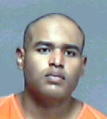 Peter Rios smiles for the camera on Saturday, following an arrest on drug charges. (Photo courtesy of SAPD)