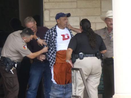 Officers take a combative man into custody. (LIVE! Photo/John Basquez)