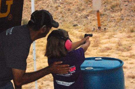 Ann Marie learns how to handle a pistol at the firing range Saturday. (LIVE! Photo/Joe Hyde)