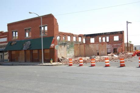 The old boot store at S. Chadbourne and Ave. B that was a burned out hull of an old building experienced a collapse of its south wall. City crews were picking up the bricks and Ave. B was roadblocked Thursday. (LIVE! Photo/Joe Hyde)