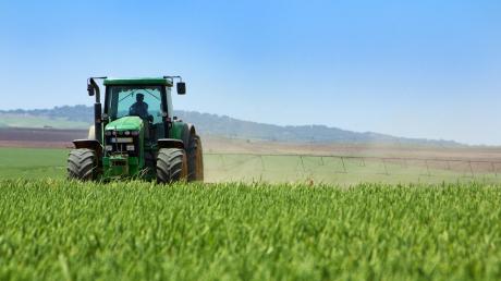 A tractor farming a field. (Contributed)