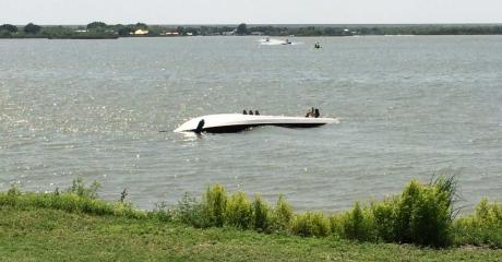A speedboat flips and capsizes on Lake Nasworthy on Saturday, June 14. (LIVE! Photo/John Basquez)