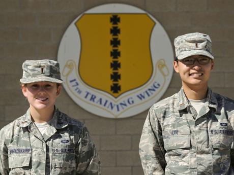 2nd Lts. Emily M. Bohnenkamp and Andrew Lim, 315th Training Squadron Students, pose for a photo in front of the Norma Brown Building Oct. 15. Lim and Bohnenkamp rescued an 8-month-old baby girl from a vehicle accident Oct. 9. (U.S. Air Force photo)