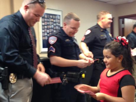 Officers receive hand-made valentines from elementary students. (LIVE! Photo/Chelsea Reinhard)