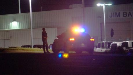 A San Angelo police officer guards one side of the perimeter as he seeks out th suspects. (LIVE! photo/John Basquez)