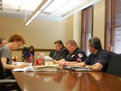 City staff and SACOP look over the minutes of a previous meeting. (LIVE! Photo/Chelsea Schmid)
