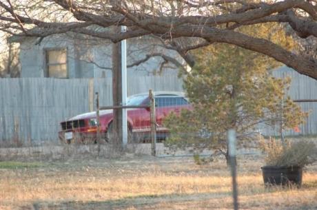 The red Ford Mustang that was abandoned by the male driver. (LIVE! Photo/John Basquez)