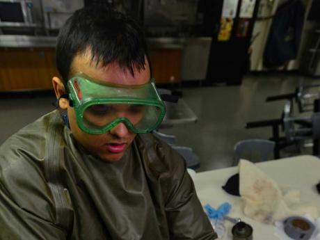 BERMERTON, Wash. (Feb. 27, 2015) Aviation Ordnanceman Airman Michael Williams, from San Angelo, Texas, pumps lube oil into an oil sump aboard USS John C. Stennis (CVN 74). Stennis is currently undergoing an operational training period.