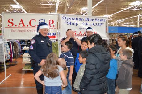 Officer Brian Bylsma visited with the participant of this year's Operation Blue Santa (LIVE Photo by Lauren Lopez)