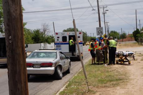 First responders immobilize driver injured in crash at 19th St. and MLK in San Angelo on Friday. (LIVE! Photo/John Basquez)