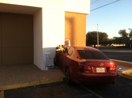 A maroon Lexus crashes into Shannon Clinic Friday morning. (LIVE! Photo/John Basquez)