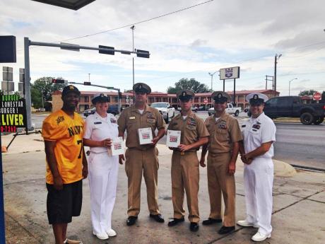Navy personnel sold Krispy Kreme donuts to raise money for retirees on Friday morning. (LIVE! Photo/Chelsea Schmid)
