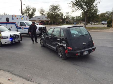 Chrysler PT Cruiser vs. semi truck on S. Koenigheim St. (LIVE! Photo/John Basquez)
