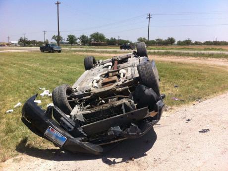 Ford Mustang in rollover crash on US 277 South near the Yellowhouse dealership on June 30, 2014. (LIVE! Photo/Matt McDaniel)
